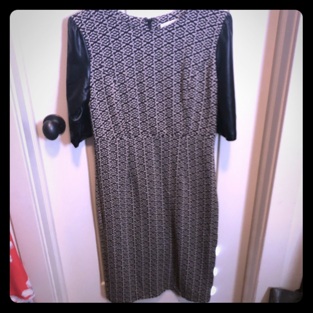 Black and cream form fitting dress